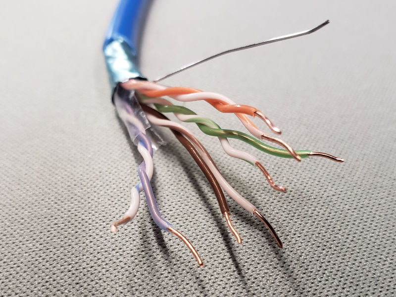 Foil-shielded Twisted Pair CAT cable showing solid conductors